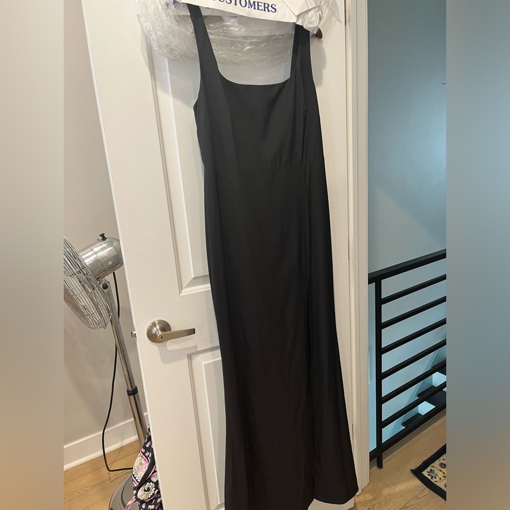 Sleek black formal dress with slit.